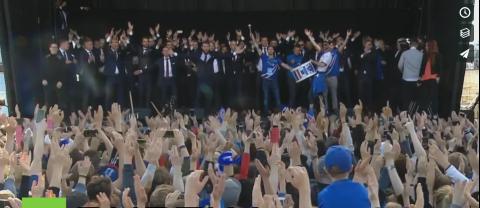 20,000 Icelandic fans do the viking clap with their soccer team to show support
